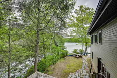a view of a lake from the side of a house at Lakefront Granby Escape with Private Dock and Kayaks! in Granby