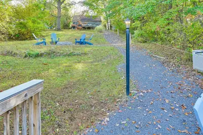 a street light next to a yard with chairs at Hot Tub Secluded Hideaway on Sleepy Hollow Lake in Athens