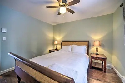 a bedroom with a bed with a ceiling fan at Hot Tub Secluded Hideaway on Sleepy Hollow Lake in Athens