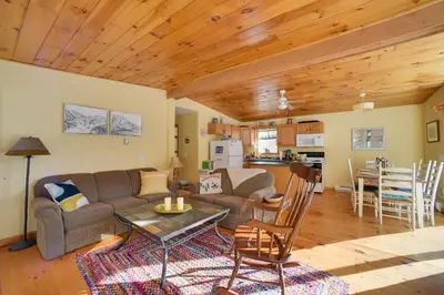 a living room with a couch and a table at Private 7-Acre Retreat On-Site Pond, Streams in Jewett