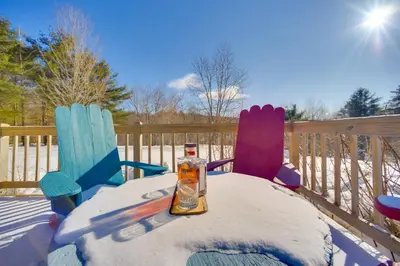 a table with two chairs and a bottle of syrup at Private 7-Acre Retreat On-Site Pond, Streams in Jewett