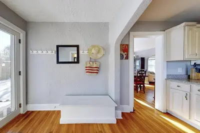 a living room with a staircase in a house at Belltown Retreat in Stamford