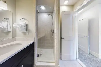 a bathroom with a shower and a sink at Belltown Retreat in Stamford
