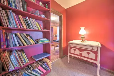 a room with a book shelf filled with books at Country Escape with Sauna, 10 Mi to Cooperstown in Richfield Springs