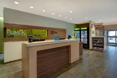 a lobby of a store with a cash register at Home2 Suites East Hanover, NJ in East Hanover