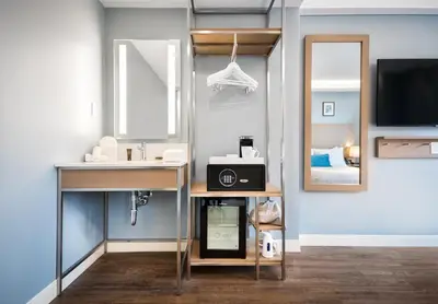a bathroom with a sink and a mirror at Wingate by Wyndham Bronx Haven Park in Bronx
