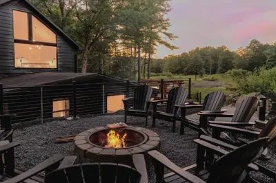 a patio with chairs and a fire pit at Pinewood Lodge - Catskills, Windham Mountain, Hunter Mountain in Catskill