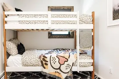 a bunk bed room with a white bunk bed at Pinewood Lodge - Catskills, Windham Mountain, Hunter Mountain in Catskill