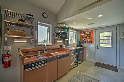 a kitchen with a sink and a stove at Fire Pit and Gas Grill Secluded Studio in Milford! in Milford