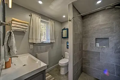 a bathroom with a toilet and a sink at Fire Pit and Gas Grill Secluded Studio in Milford! in Milford
