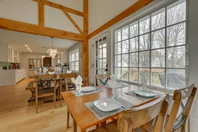 a kitchen and dining room with a table and chairs at Chic Dover Home with Hot Tub 1 Mi to Golf! in West Dover