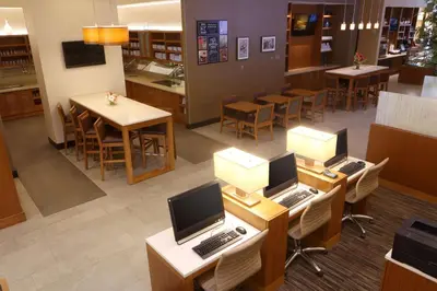 an overhead view of a restaurant with laptops on tables at Hyatt Place Flushing/LGA Airport in Queens