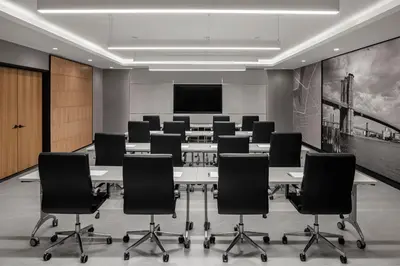 a conference room with a large table and chairs at Four Points by Sheraton Flushing in Queens