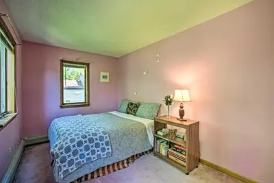 a small bedroom with a bed and a window at Lakeside Berkshires Home Near Hiking and Skiing! in Lanesborough