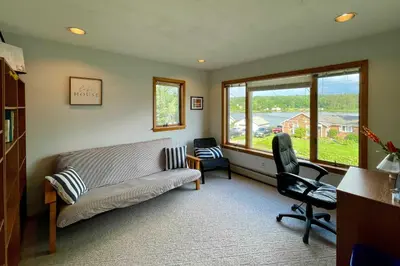 a living room with a couch and two chairs at Lakeside Berkshires Home Near Hiking and Skiing! in Lanesborough