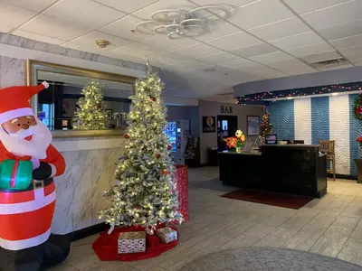 a christmas tree in the lobby of a store at Albany Airport Inn in Albany