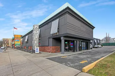 a building on the side of a street at Casa Azul Hotel Blu-UBS Arena in Queens