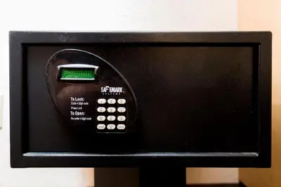 a microwave with a remote control on top of it at Red Roof Inn Utica in Utica