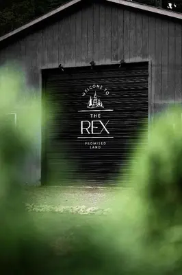 a garage door with the words the rex on it at The Rex in Greentown