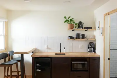 a kitchen with a wooden counter and a counter top at The Rex in Greentown