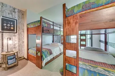 a bedroom with two bunk beds and a fireplace at 4 Mi to Windham Mountain Ski Getaway! in Windham