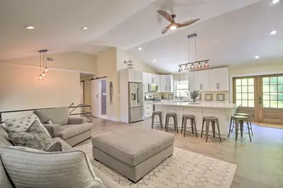 a living room and kitchen with a couch and a table at Modern NY Home with Views By Hudson Valley Hiking! in Hopewell Junction