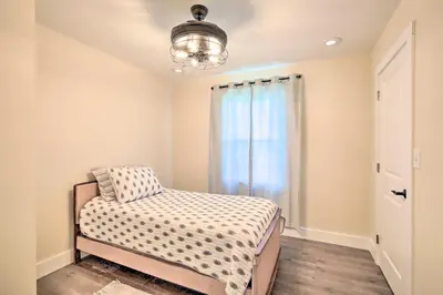 a bedroom with a bed and a window at Modern NY Home with Views By Hudson Valley Hiking! in Hopewell Junction