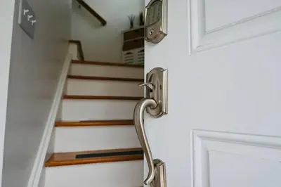 an open door with a staircase in the background at Bright & cozy * 2nd Floor Apartment*. Close to NYC in Bloomfield