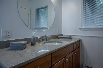 a bathroom with a sink and a mirror at Summer and Fall in Sheffield with Monthly Special Pricing Available in Sheffield