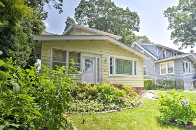 a house with a garden in front of it at Charming Yonkers Retreat - 10 Mi to Central Park! in Yonkers
