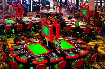 a bunch of slot machines in a casino at Nice Cozy Room By Empire City Casino And Cross County Mall in Yonkers