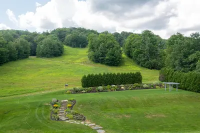 a grassy hill with a garden in the middle at Grand Summit Resort, A Vail Resorts Property in Dover