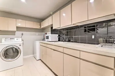 a kitchen with a washing machine and a washer at Game Room! Poconos Paradise 10 Mi to Ski Slopes in East Stroudsburg