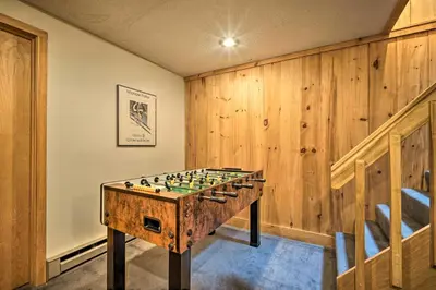 a wooden room with a chess board on a table at Spacious Dover Home with Sauna Less Than 5 Miles to Ski! in Dover