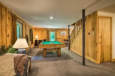 a room with a pool table and wooden walls at Spacious Dover Home with Sauna Less Than 5 Miles to Ski! in Dover