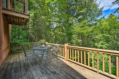 a patio with a table and chairs on a deck at Spacious Dover Home with Sauna Less Than 5 Miles to Ski! in Dover