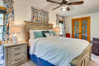 a bedroom with a bed and a ceiling fan at Game Room and Yard Greentown Home Near State Park in Greentown