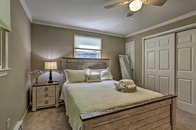 a bedroom with a bed and a ceiling fan at Deck and Gas Grill Modern East Stroudsburg Home! in East Stroudsburg