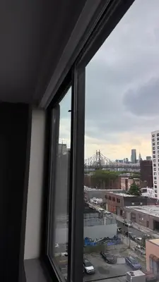 a view of a city from a window at Capital Hotel Long Island City in Queens