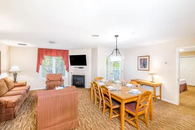 a living room with a table and a couch at Vacation Village in the Berkshires in Hancock