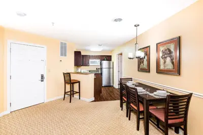 a dining room and kitchen with a table and chairs at Vacation Village in the Berkshires in Hancock