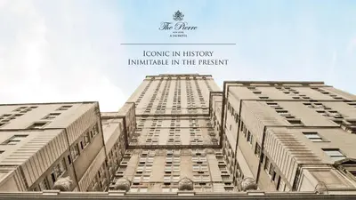 a view of two tall buildings with the words lounging in history insurance in at The Pierre, A Taj Hotel, New York in New York