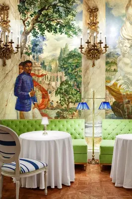 a living room with a painting on the wall at The Pierre, A Taj Hotel, New York in New York
