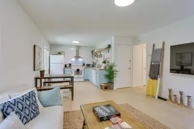 a living room with a couch and a table at Cozy Swan Lake Apt with Grill and Private Yard in Swan Lake
