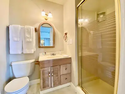 a bathroom with a toilet sink and a shower at Bloom Farm Guesthouse in Mount Vision