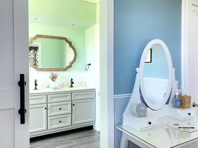 a bathroom with a white vanity and a mirror at Bloom Farm Guesthouse in Mount Vision