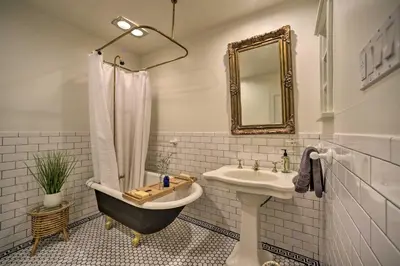 a bathroom with a sink and a bath tub and a bath tub at Game Room and Fire Pit Peaceful Catskills Farmhouse in Treadwell
