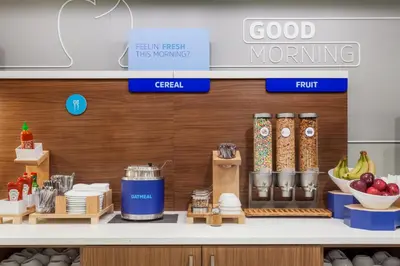 a kitchen with a counter with food items on it at Holiday Inn Express & Suites Peekskill-Lower Hudson Valley by IHG in Peekskill
