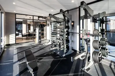 a fitness room with a gym with weights at Global Luxury Suites at The Arches in Bronx