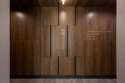 a large wooden wall with a sign on it at Global Luxury Suites at The Arches in Bronx